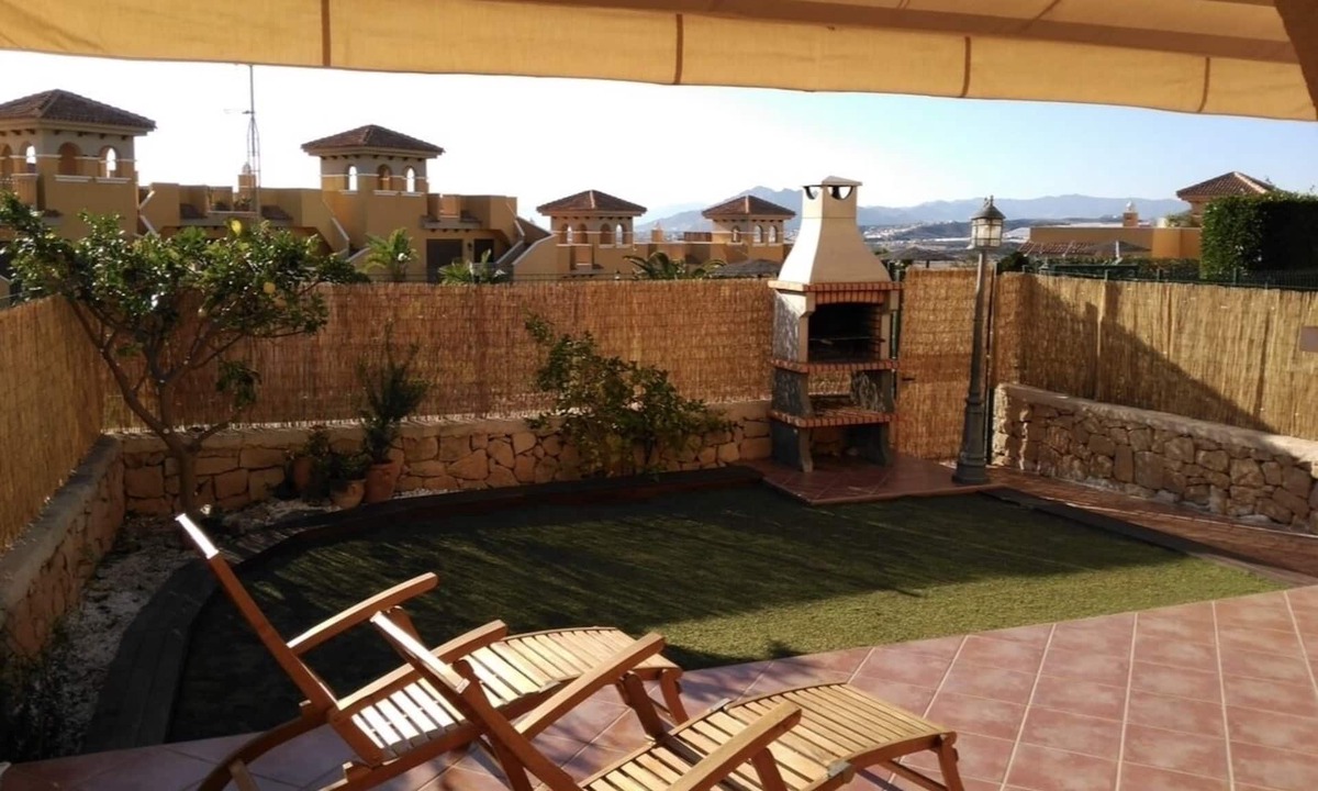Isla Plana Apartment | Charming and spacious ground floor apartment with own gardens and shared pool