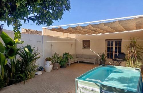 Carrion De Los Cespedes Apartment | Design & art, patio with orange tree, near Seville