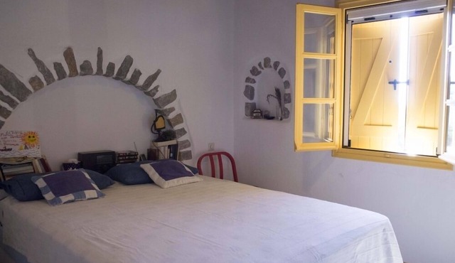 Artemis Villa, stone villa with terraces and sea view.