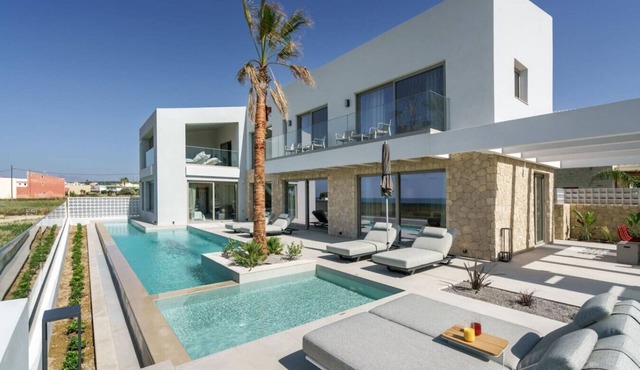 Beachfront Villa with Eco heated Pool, Hot Tub, Playroom and walk to restaurants